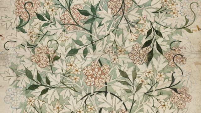An intricate floral pattern with green leaves and pink flowers is arranged symmetrically on a textured background.